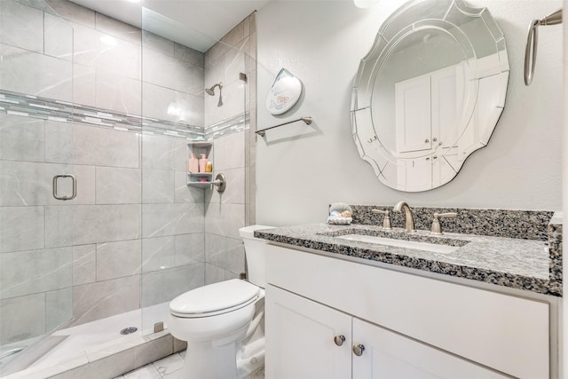 5709 Ridgehaven, Plano, TX 75093 - bathroom featuring toilet, a stall shower, and vanity