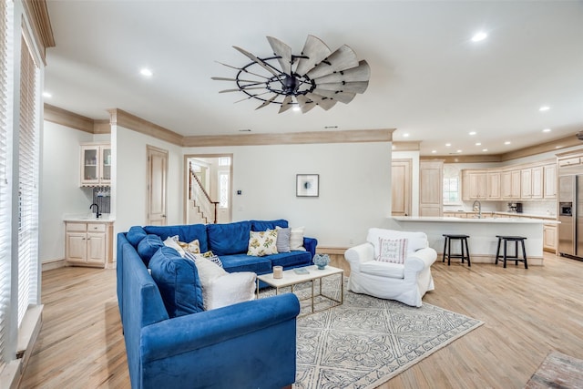 5709 Ridgehaven, Plano, TX 75093 - living area with light wood-style flooring, stairway, recessed lighting, ornamental molding, and baseboards