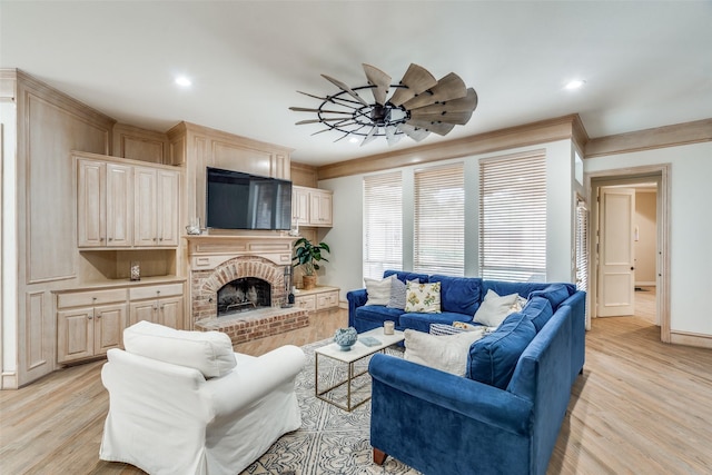 5709 Ridgehaven, Plano, TX 75093 - living area with light wood-type flooring, recessed lighting, a fireplace, ornamental molding, and baseboards