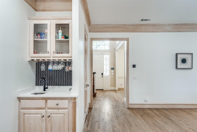 5709 Ridgehaven, Plano, TX 75093 - hallway with a sink, crown molding, light wood-style floors, and baseboards