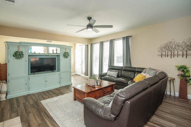 12073 Tyler Dr, Frisco, TX 75035 - living area with ceiling fan, dark wood finished floors, and baseboards