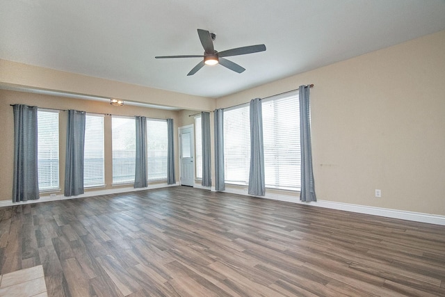 12073 Tyler Dr, Frisco, TX 75035 - empty room with a ceiling fan, baseboards, wood finished floors, and healthy amount of natural light