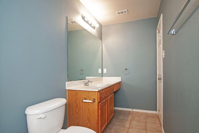 12073 Tyler Dr, Frisco, TX 75035 - bathroom featuring vanity, toilet, tile patterned flooring, and baseboards