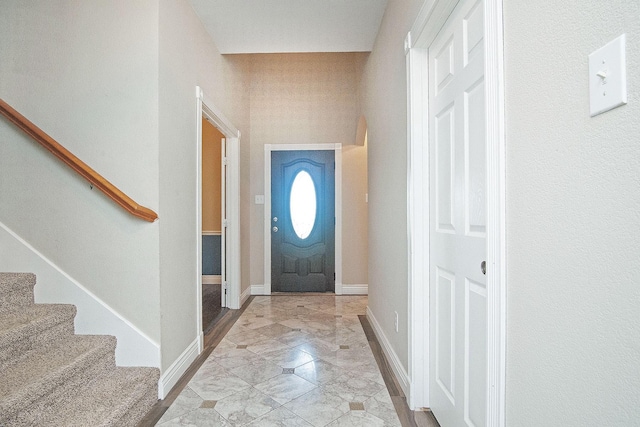 12073 Tyler Dr, Frisco, TX 75035 - entryway featuring light marble finish floors, stairs, and baseboards