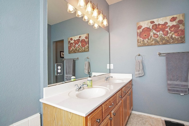 12073 Tyler Dr, Frisco, TX 75035 - bathroom with double vanity and baseboards