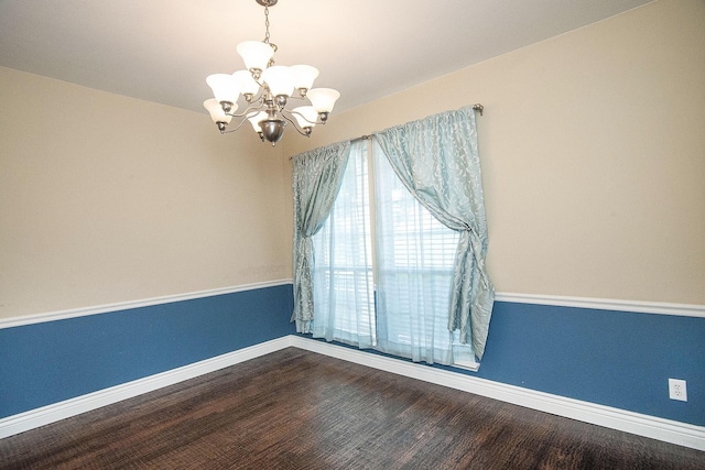 12073 Tyler Dr, Frisco, TX 75035 - unfurnished room featuring a chandelier, baseboards, and wood finished floors