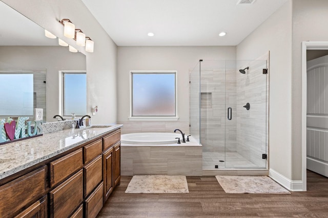 1829 White Mound Rd, Sherman, TX 75090 - bathroom featuring a garden tub, vanity, wood finished floors, recessed lighting, and a stall shower