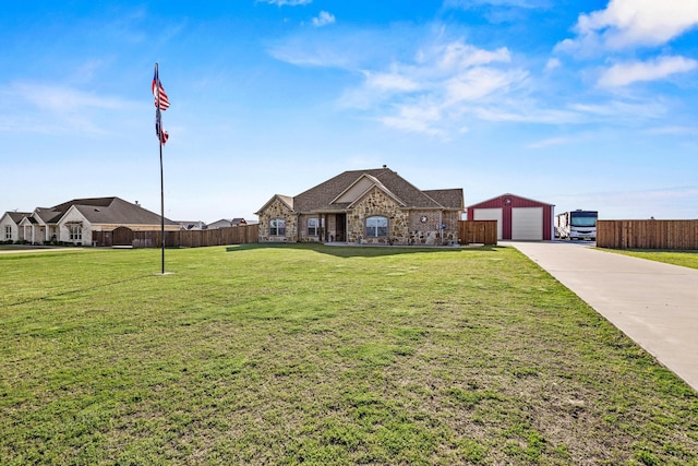 1829 White Mound Rd, Sherman, TX 75090 - view of front of property featuring an outdoor structure, a front lawn, fence, stone siding, and a detached garage