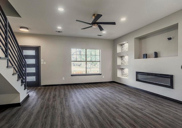 6609 Rockdale Rd, Fort Worth, TX 76134 - unfurnished living room with stairs, dark wood-style floors, built in shelves, and visible vents