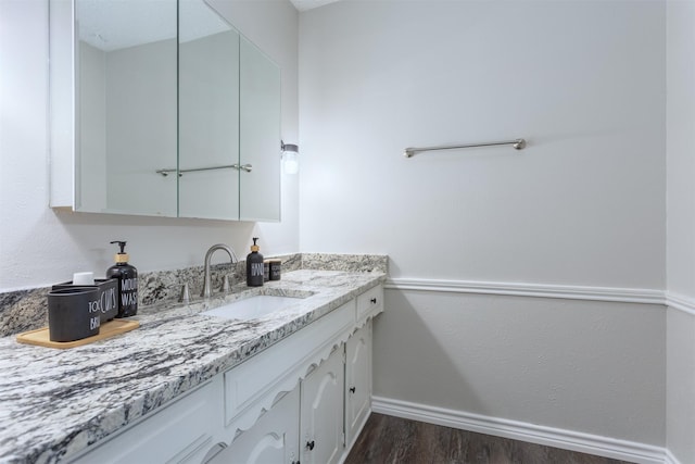 7 Harolds Cir, Richardson, TX 75081 - bathroom featuring wood finished floors and vanity
