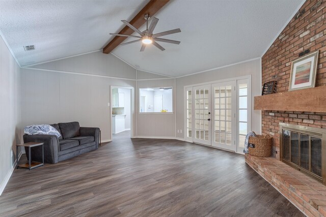 7 Harolds Cir, Richardson, TX 75081 - unfurnished living room featuring ceiling fan, dark wood-style floors, a fireplace, french doors, and a textured ceiling