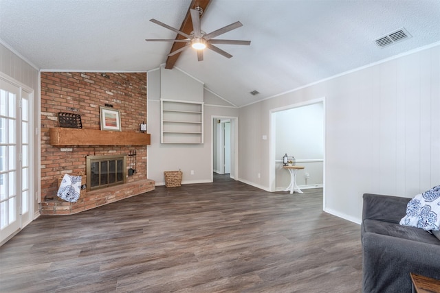 7 Harolds Cir, Richardson, TX 75081 - unfurnished living room featuring ceiling fan, wood finished floors, a fireplace, a textured ceiling, and built in features