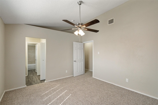 unfurnished bedroom featuring baseboards, carpet flooring, and visible vents