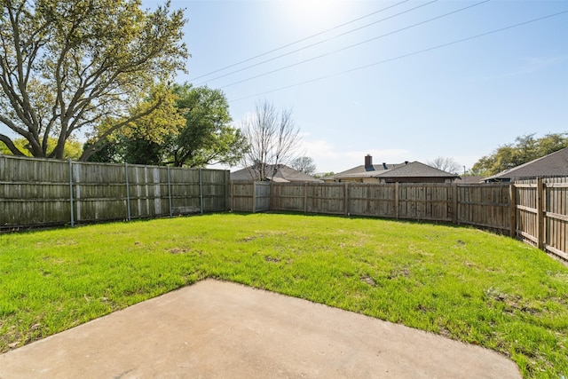 view of yard featuring a fenced backyard and a patio