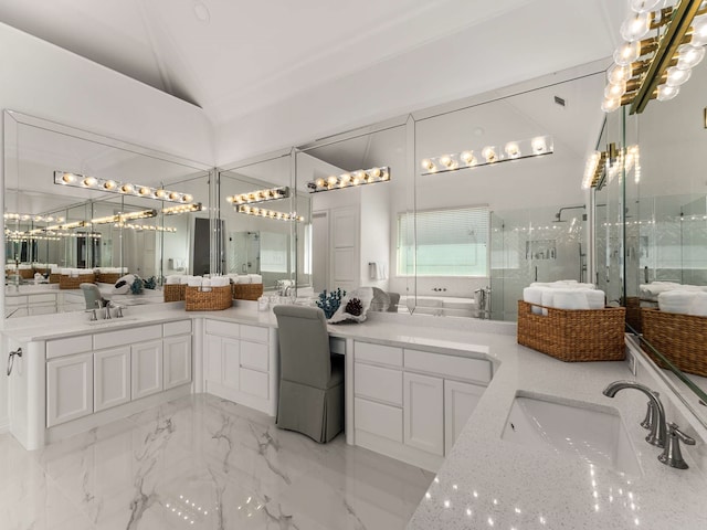 full bathroom featuring a sink, a shower stall, vaulted ceiling, and double vanity