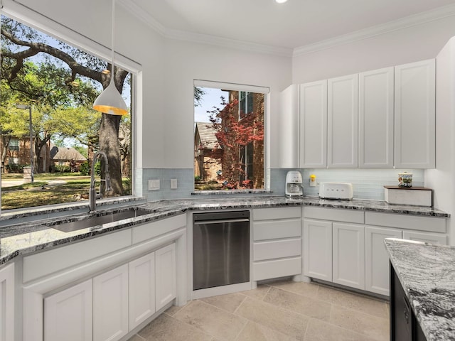 kitchen featuring stainless steel dishwasher, decorative backsplash, white cabinetry, light stone counters, and a sink
