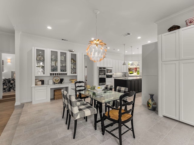 dining area featuring visible vents, ornamental molding, and recessed lighting