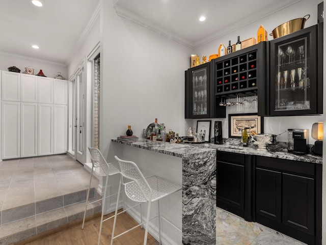 bar with crown molding, recessed lighting, and wet bar