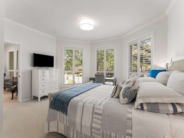 bedroom with light colored carpet, ornamental molding, and baseboards