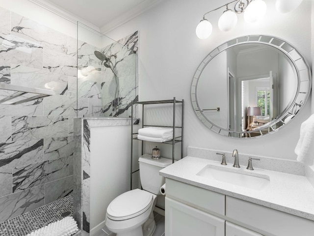 bathroom with crown molding, a marble finish shower, toilet, and vanity