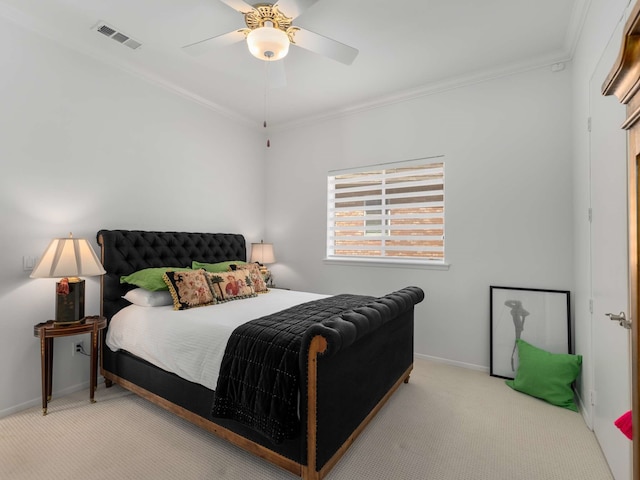 bedroom with crown molding, baseboards, and carpet floors