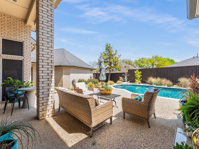 view of pool featuring a fenced in pool, a fenced backyard, a patio area, and an outdoor living space