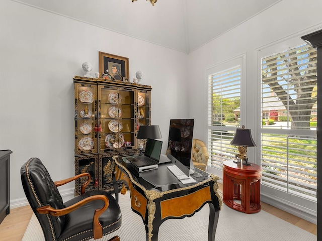 office with baseboards, wood finished floors, and lofted ceiling