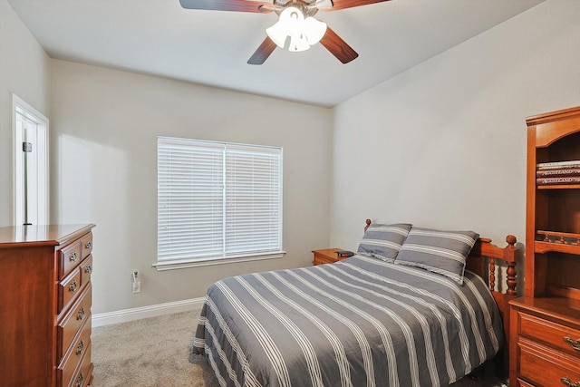 bedroom featuring baseboards, carpet, and a ceiling fan