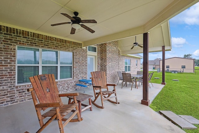 view of patio featuring outdoor dining space and ceiling fan