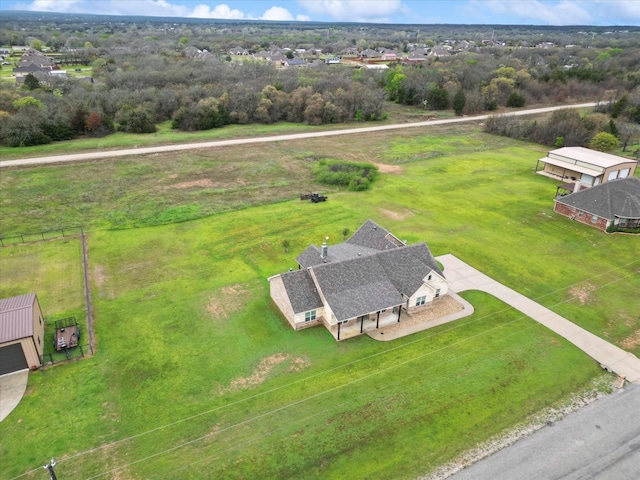 birds eye view of property with a rural view