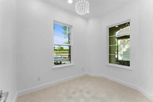 6048 Vz County Rd Unit 2120, Wills Point, TX 75169 - spare room with baseboards and an inviting chandelier