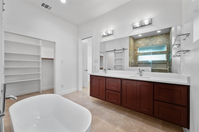 6048 Vz County Rd Unit 2120, Wills Point, TX 75169 - bathroom featuring a sink, visible vents, a freestanding bath, and double vanity