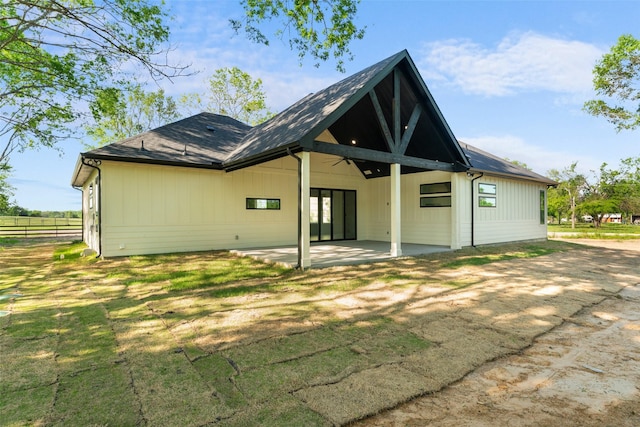 6048 Vz County Rd Unit 2120, Wills Point, TX 75169 - back of property featuring fence, a patio, a lawn, and roof with shingles