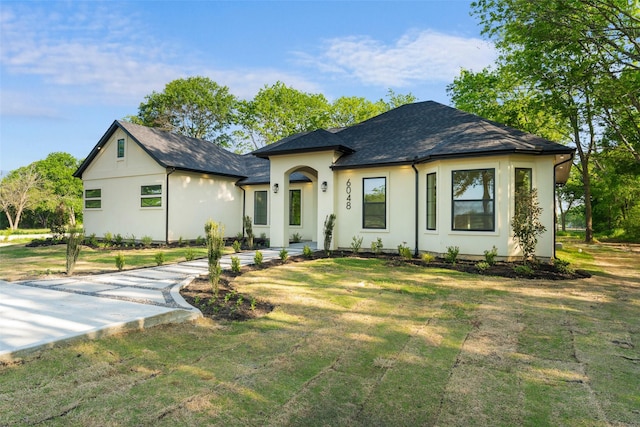 6048 Vz County Rd Unit 2120, Wills Point, TX 75169 - view of front of house featuring a front yard, stucco siding, and a shingled roof