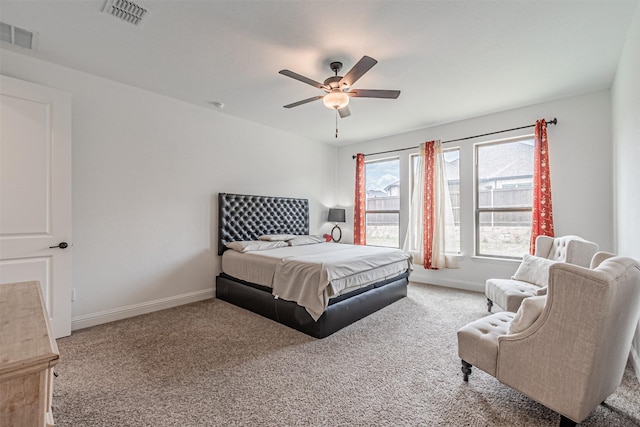 bedroom with carpet flooring, baseboards, and visible vents