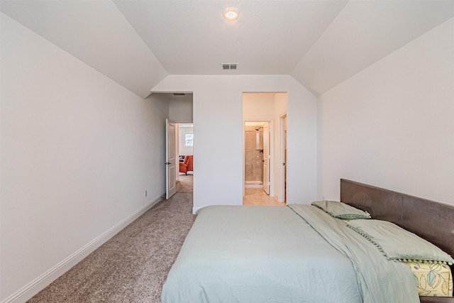 bedroom with baseboards, lofted ceiling, visible vents, and light colored carpet