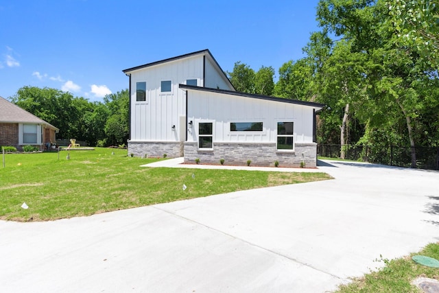403 Tealridge Ct, Desoto, TX 75115 - view of front facade with board and batten siding, concrete driveway, and brick siding