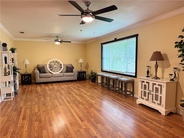 2717 Old Robinson Rd, Waco, TX 76706 - living area featuring ceiling fan, wood finished floors, crown molding, and baseboards
