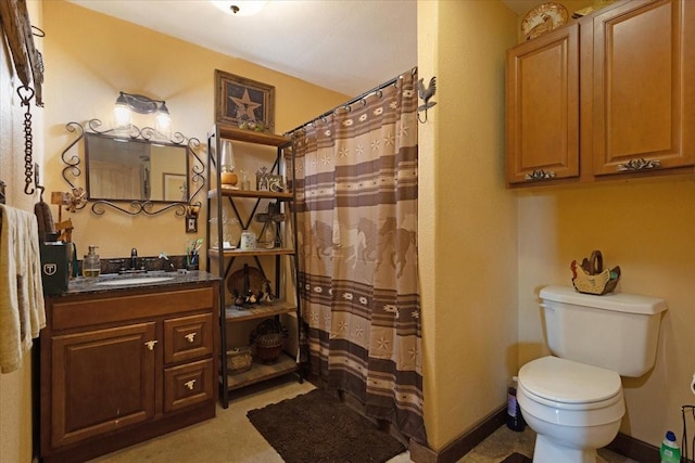 full bathroom featuring vanity, toilet, and curtained shower
