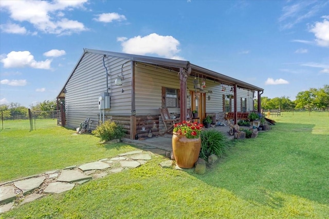 view of outbuilding featuring fence