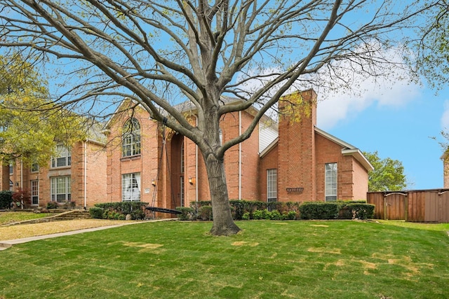 4516 Chesterwood Dr, Plano, TX 75093 - traditional-style house featuring brick siding and a chimney