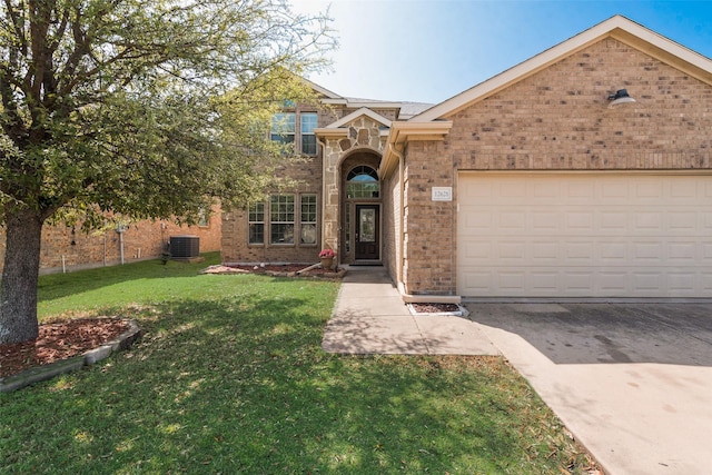 traditional home with a garage, concrete driveway, a front yard, brick siding, and cooling unit