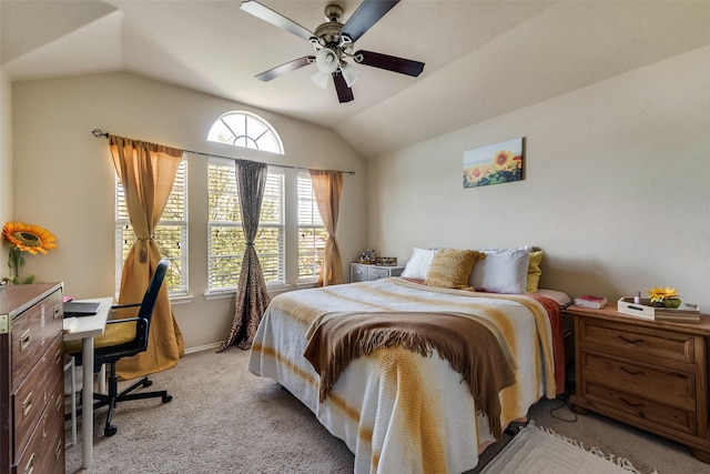 bedroom with ceiling fan, vaulted ceiling, and light carpet