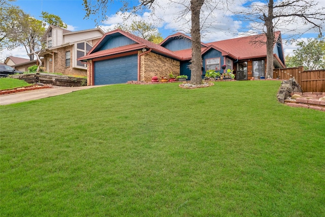 view of front of house with driveway, fence, an attached garage, brick siding, and a front lawn
