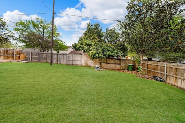 view of yard with a fenced backyard