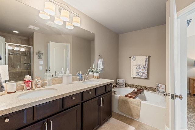 bathroom with a bath, visible vents, a sink, and a shower stall