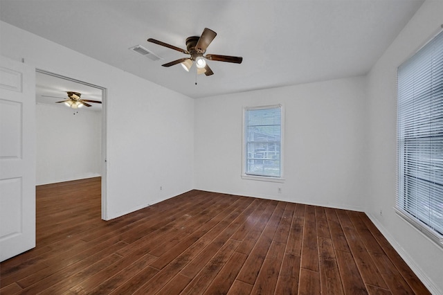 1326 W Shepherd St, Denison, TX 75020 - spare room featuring ceiling fan and dark wood-type flooring