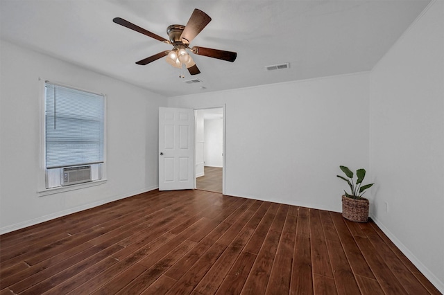 1326 W Shepherd St, Denison, TX 75020 - unfurnished room featuring dark wood-style floors, a ceiling fan, cooling unit, and baseboards
