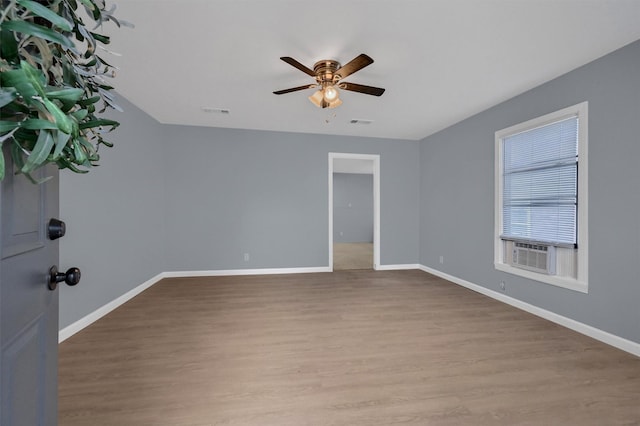 1326 W Shepherd St, Denison, TX 75020 - empty room with a ceiling fan, wood finished floors, baseboards, and cooling unit