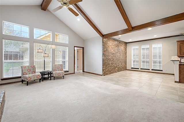2215 Burgundy Dr, Carrollton, TX 75006 - sitting room featuring light tile patterned floors, a ceiling fan, beamed ceiling, high vaulted ceiling, and light colored carpet